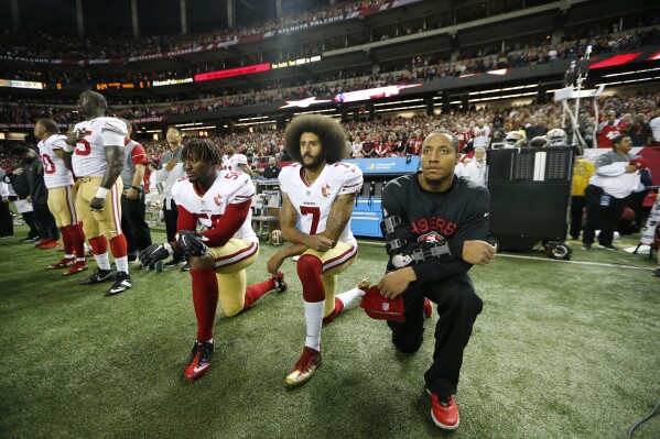 San Francisco 49ers quarterback Colin Kaepernick (7) and San Francisco 49ers outside linebacker Eli Harold (58) kneel during the playing of the national anthem before the first half of an NFL football game between the Atlanta Falcons and the San Francisco 49ers, Sunday, Dec. 18, 2016, in Atlanta. (AP Photo/John Bazemore, File)